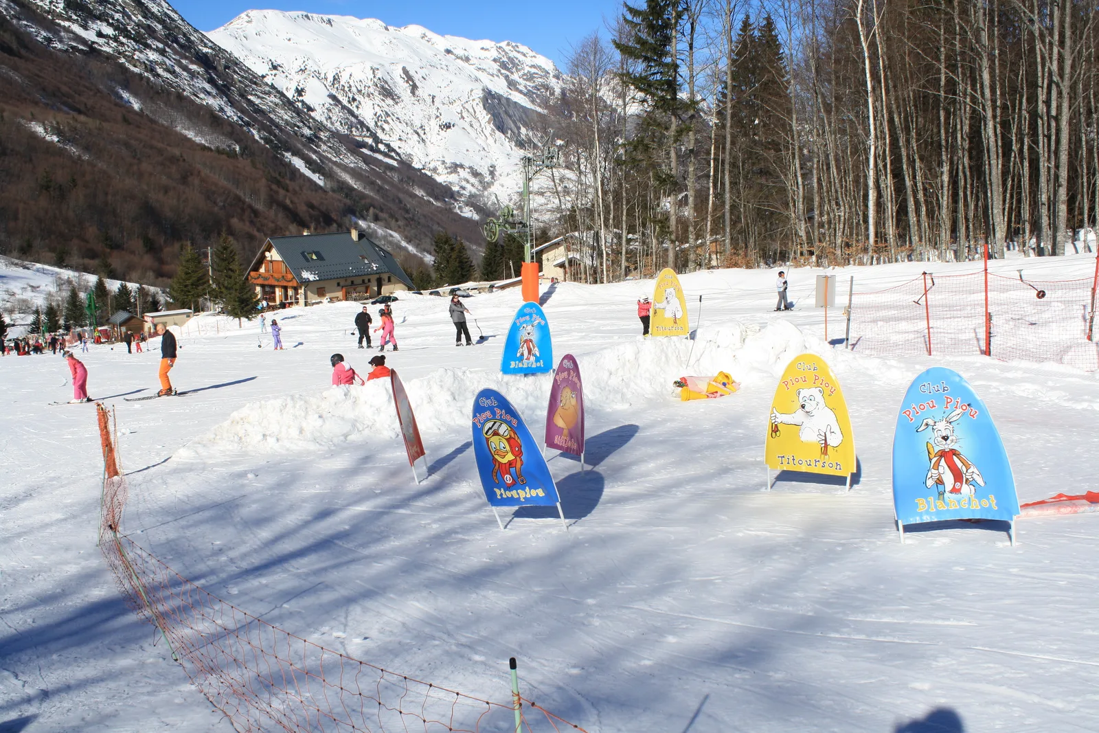 Col d'Ornon in France - a group of people skiing in the snow.