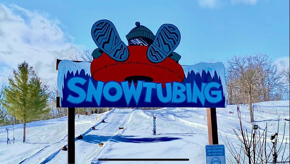 A Snowmobile scene at Snow Snake ski resort in Michigan USA highlighting a winter sports setup with stunning winter scenery in the backdrop.