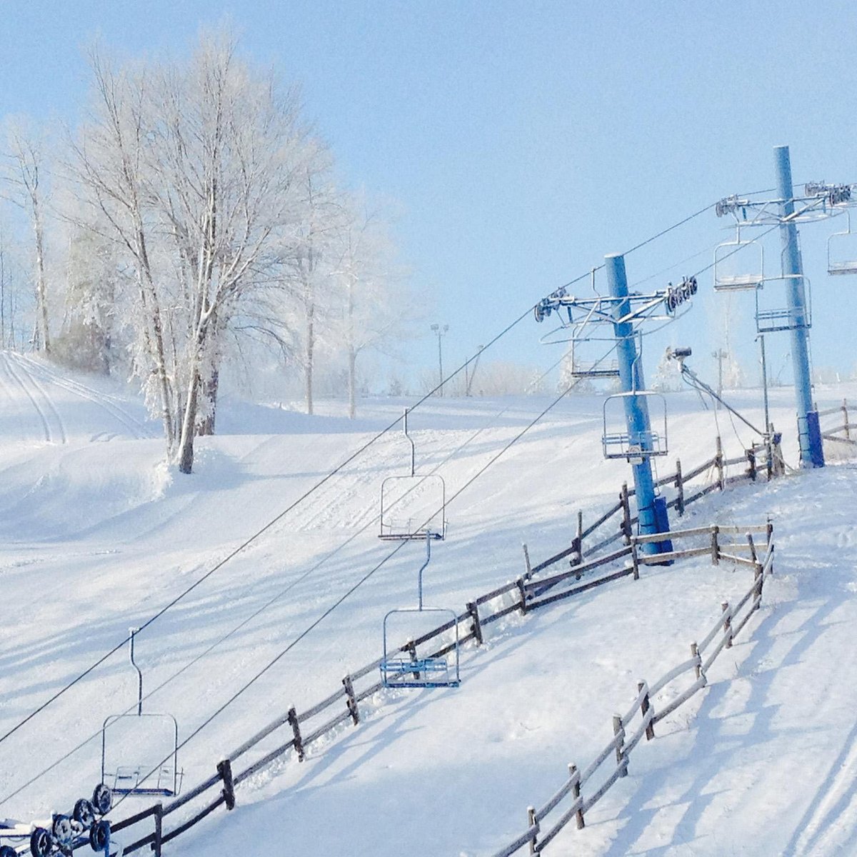 Snow Snake in USA - a man riding a snowboard down a slope.
