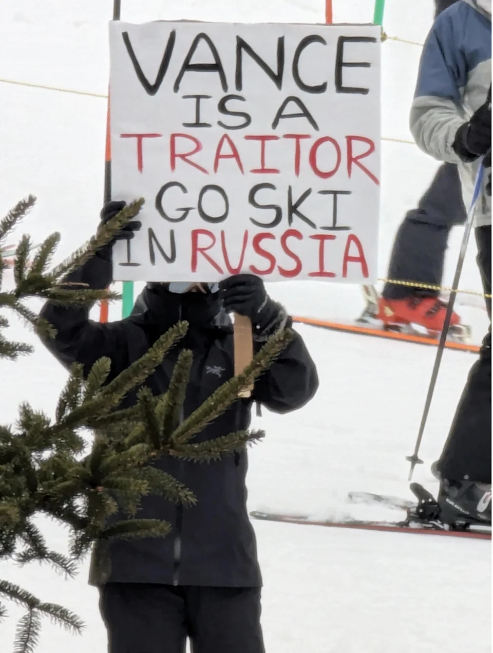 Salma in Russia - a person holding a sign in the snow.