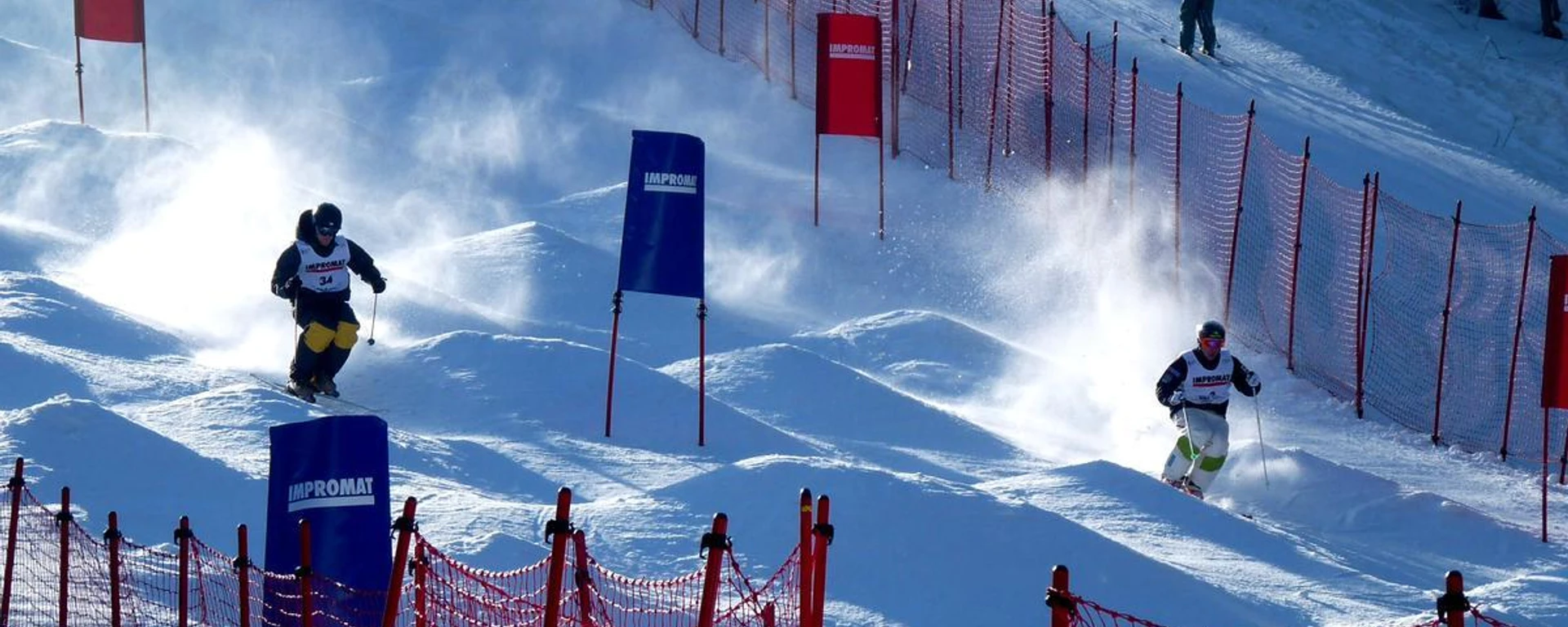 Ski resort Mariánky in Czech Republic - two skiers are racing down a snowy slope.