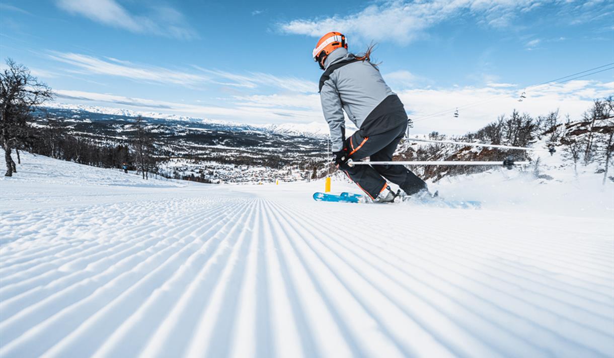 Vierli – Rauland in Norway - a snowboarder going down a slope.
