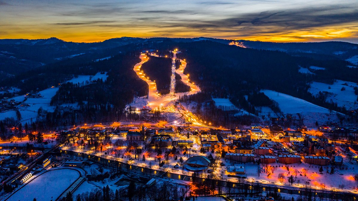 Stacja Narciarska Skolnity Ski & Bike Park in Poland: a ski resort lit up at night.