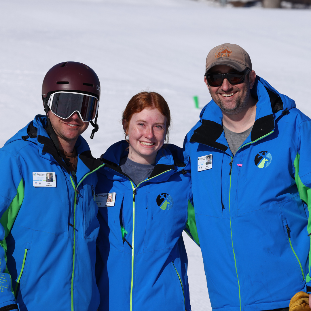Buck Hill in USA - three people standing in the snow.