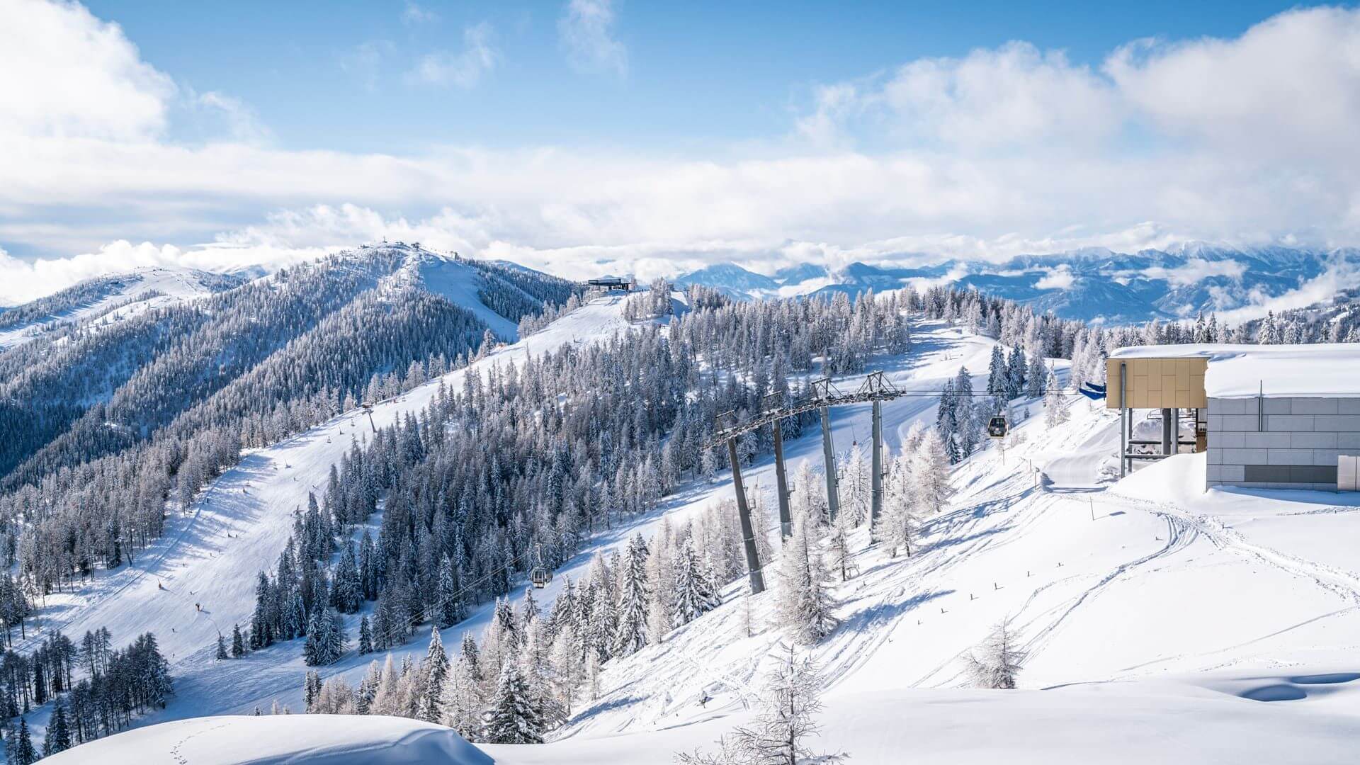View of the Bad Kleinkirchheim ski resort in Upper Carinthia, Austria. The stunning winter scenery showcases snow-covered slopes and vibrant winter sports activities.