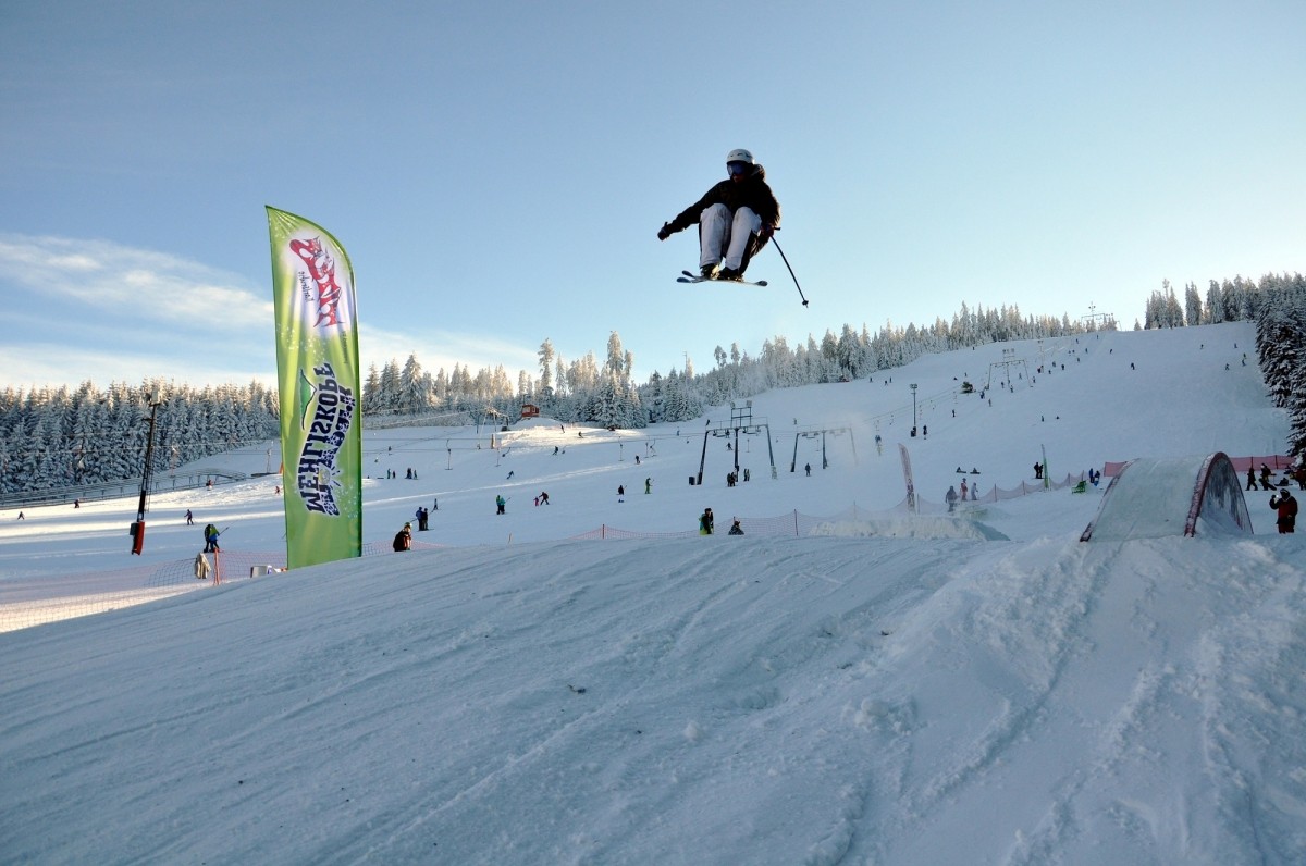 Mehliskopf in Germany - a man flying through the air while riding a snowboard.