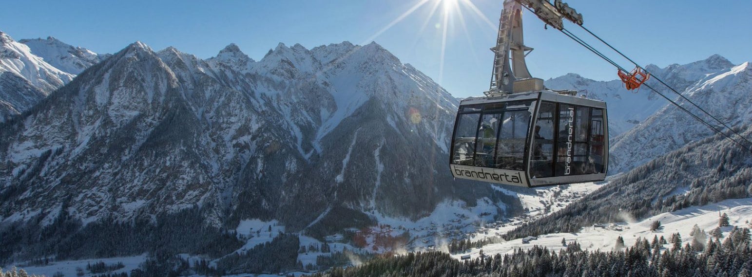 Brandnertal – Brand | Bürserberg in Austria - a ski lift going up a snowy mountain.