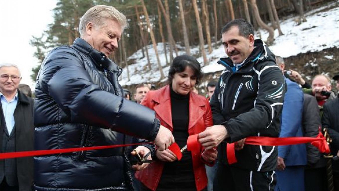 Armkhi in Russia - a group of people cutting a ribbon in the snow.