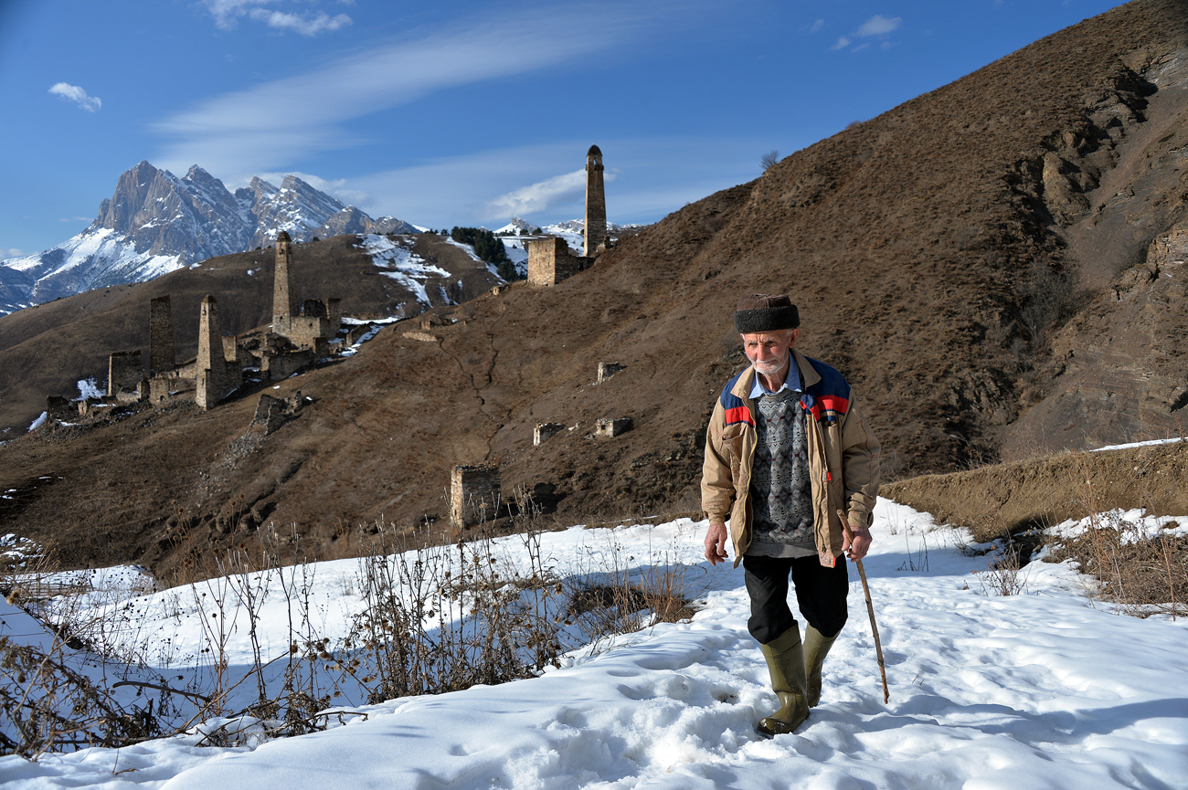 Armkhi in Russia - a man walking in the snow with a backpack.