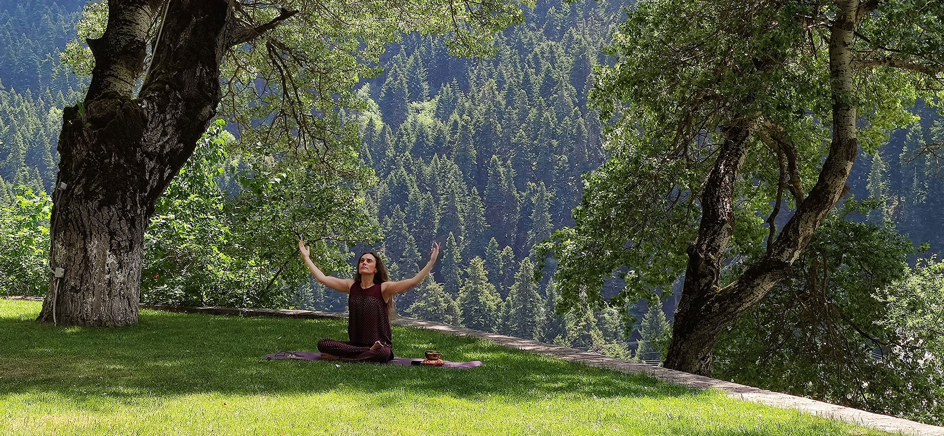 Koziakas – Pertouli in Greece - a woman doing yoga in the mountains.