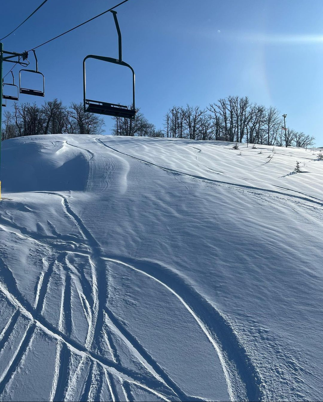 Bottineau Winter Park in USA - a ski lift going up a snowy slope.