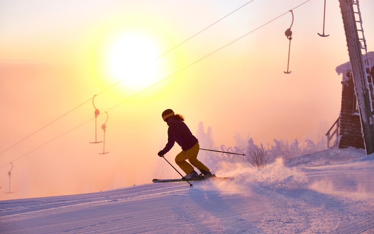 Rehefeld-Zaunhaus in Germany - a person riding skis down a snowy slope.