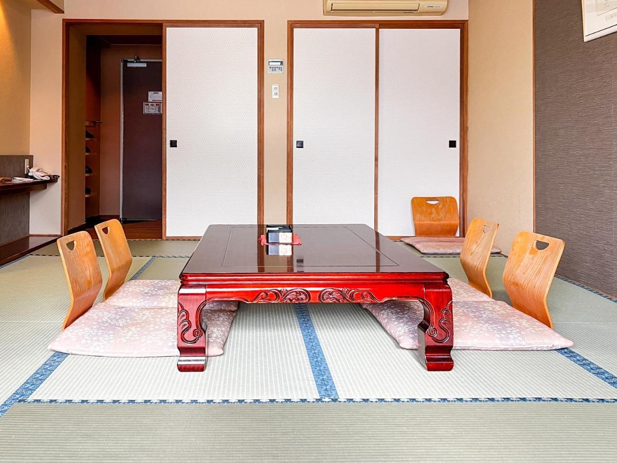 Kokusetsu Akankohan in Japan - a room with a table and chairs in it.