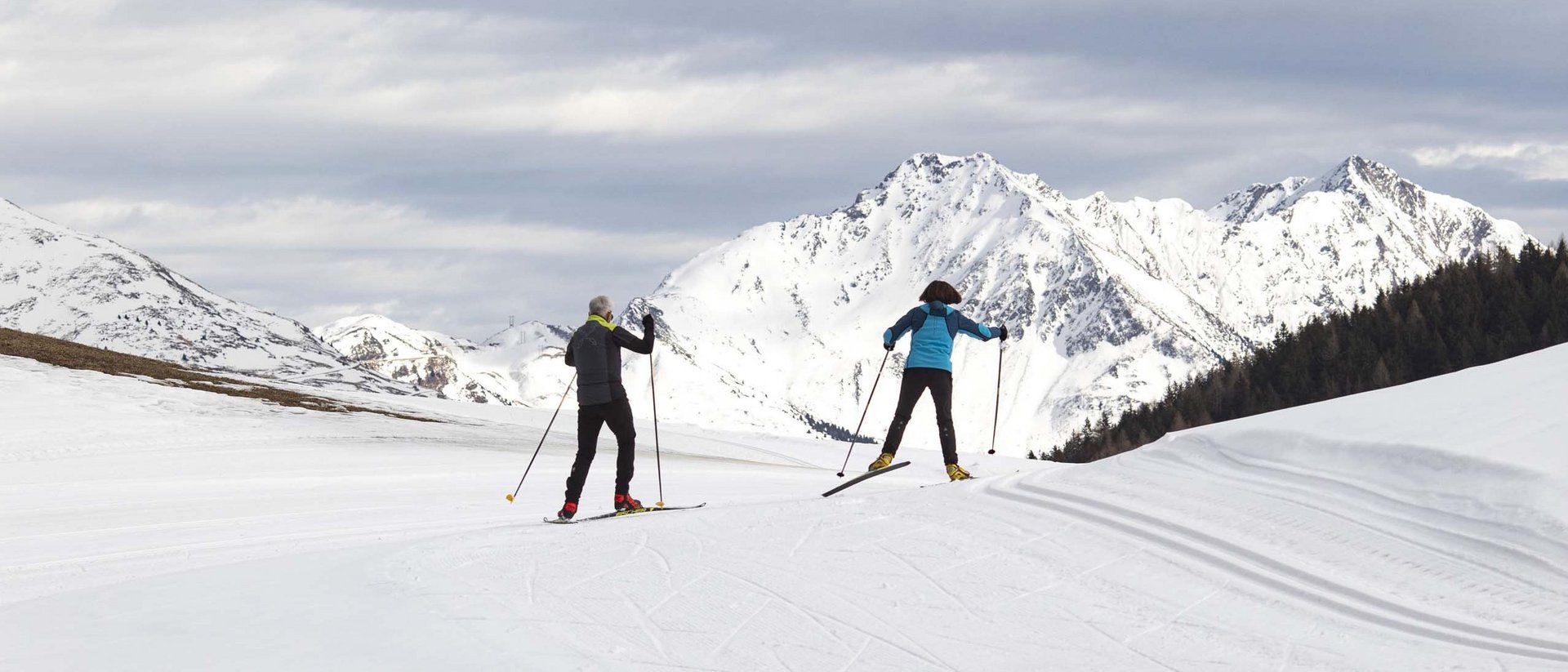 Pfelders in Italy - two people are skiing down a snowy slope.