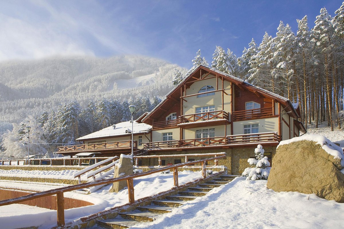Blagodat – Belokuricha in Russia - a house in the mountains covered in snow.