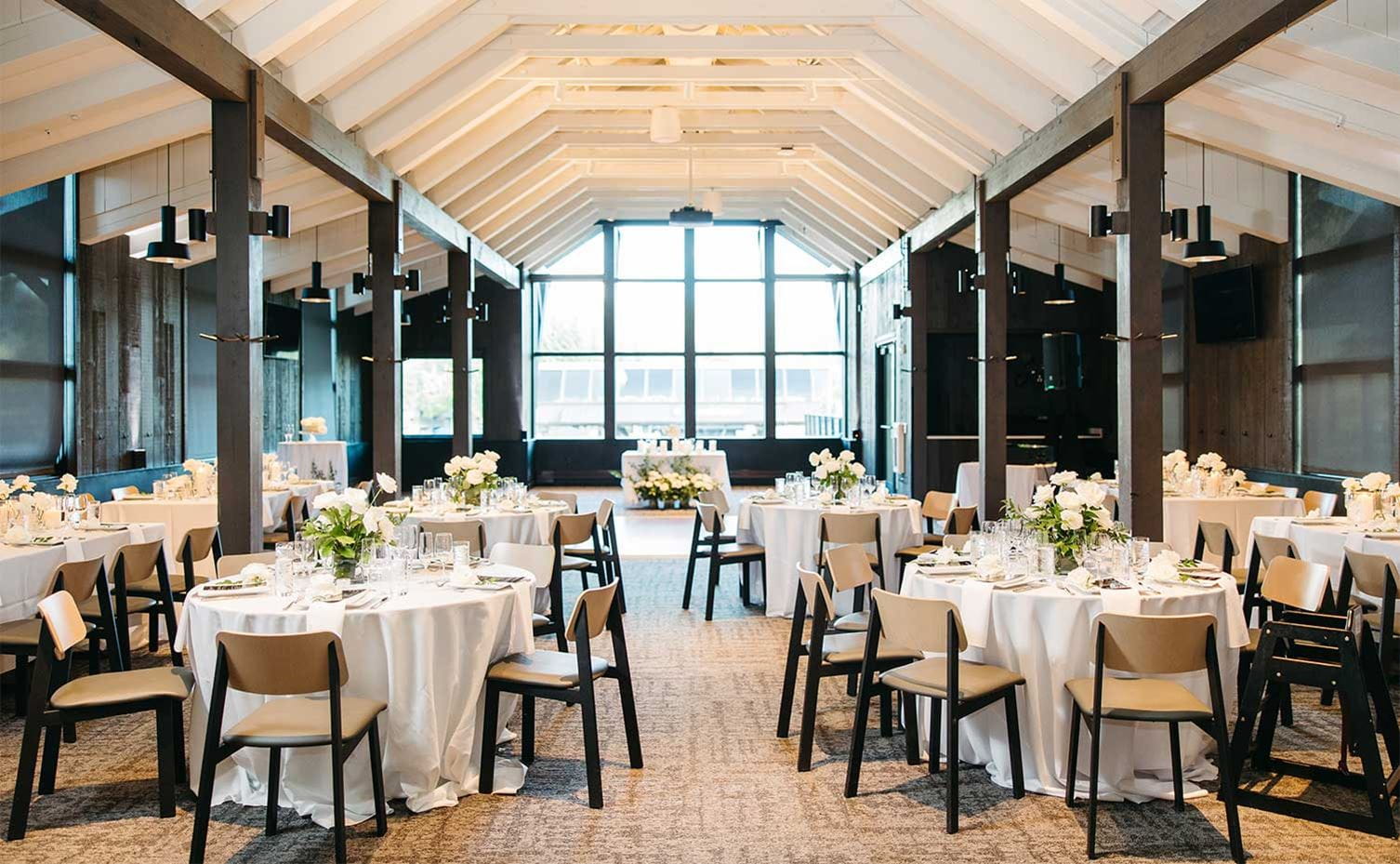 Buttermilk Mountain in USA - a dining room with white tables and chairs.