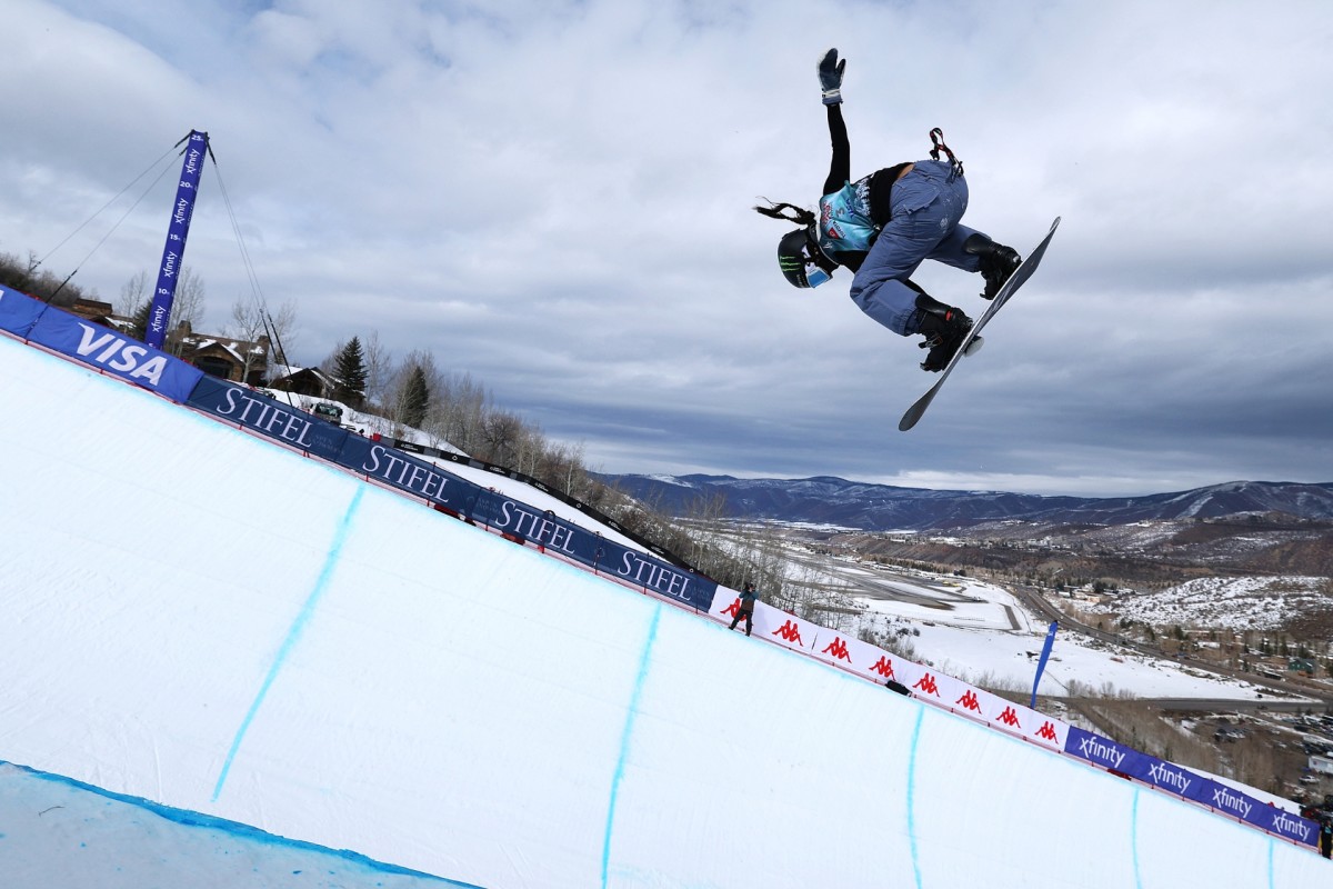 Buttermilk Mountain in USA - a snowboarder doing a trick in the air.
