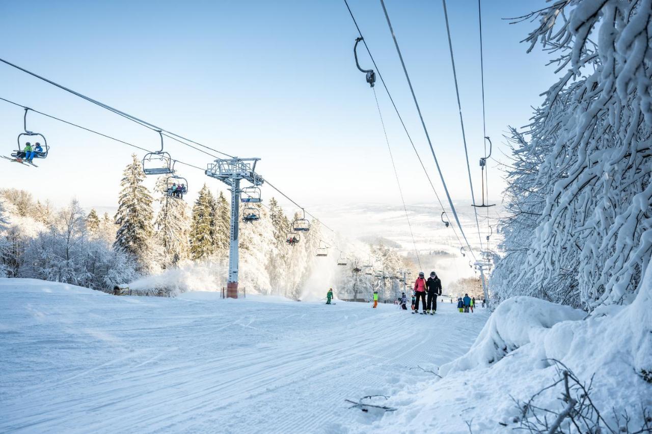 Monínec – Sedlec-Prčice in Czech Republic - a ski lift going up a snowy slope.