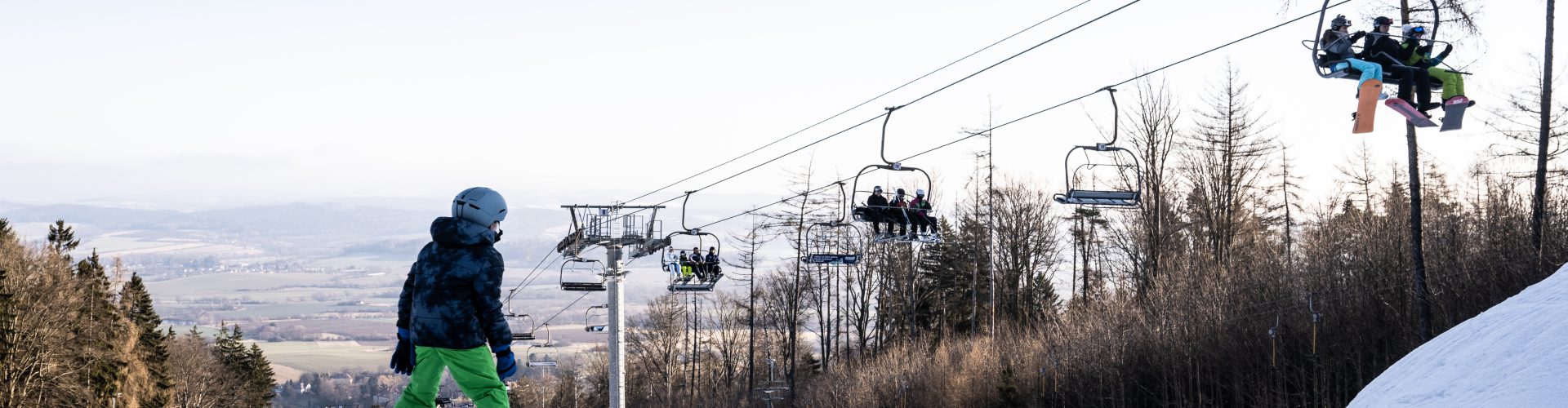 Monínec – Sedlec-Prčice in Czech Republic - a person riding a ski board on a snowy slope.