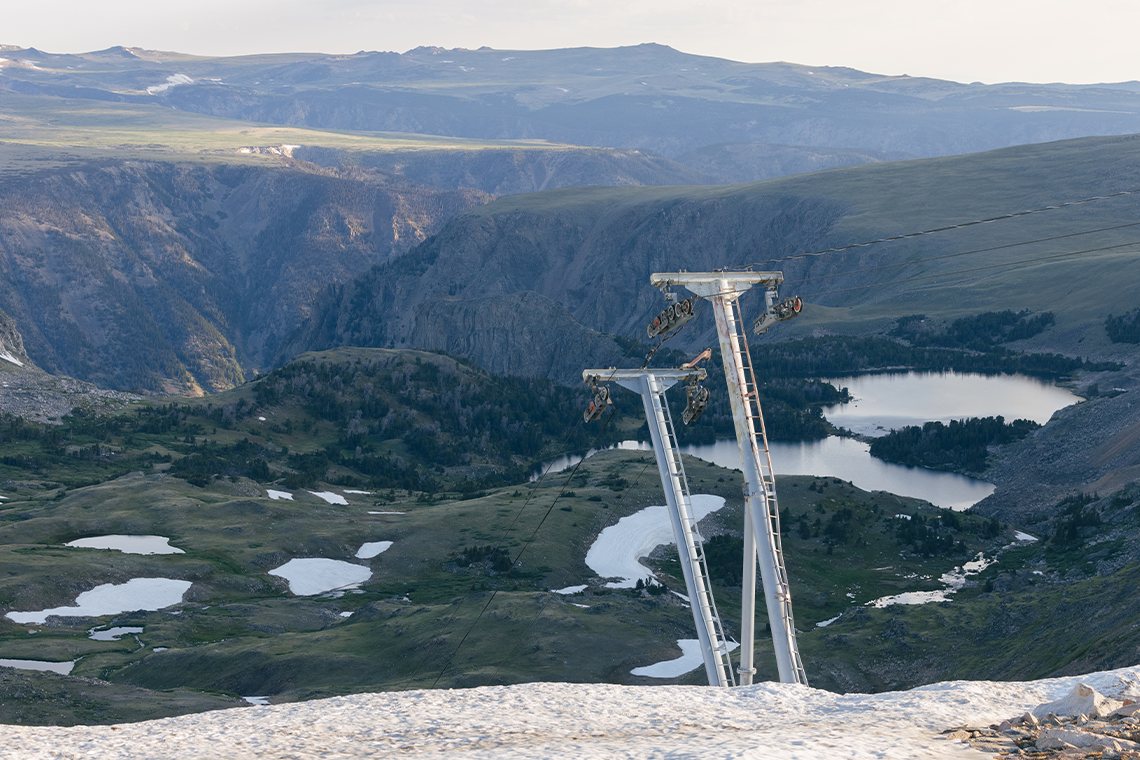 Beartooth Basin in USA - a ski board sitting on top of a snow covered mountain.