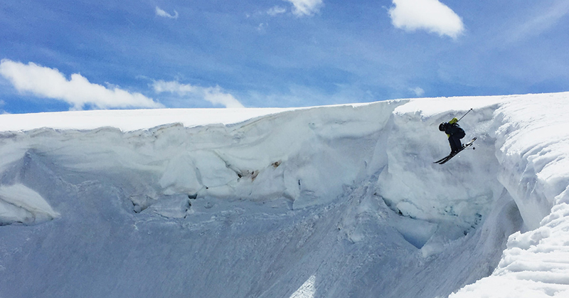 Beartooth Basin in USA - a person on a snowboard in the snow.