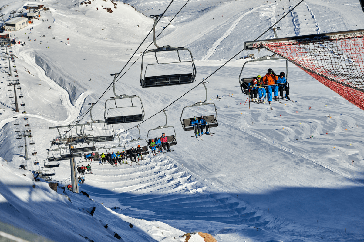 Val Senales Glacier in Italy - a group of people skiing down a mountain.