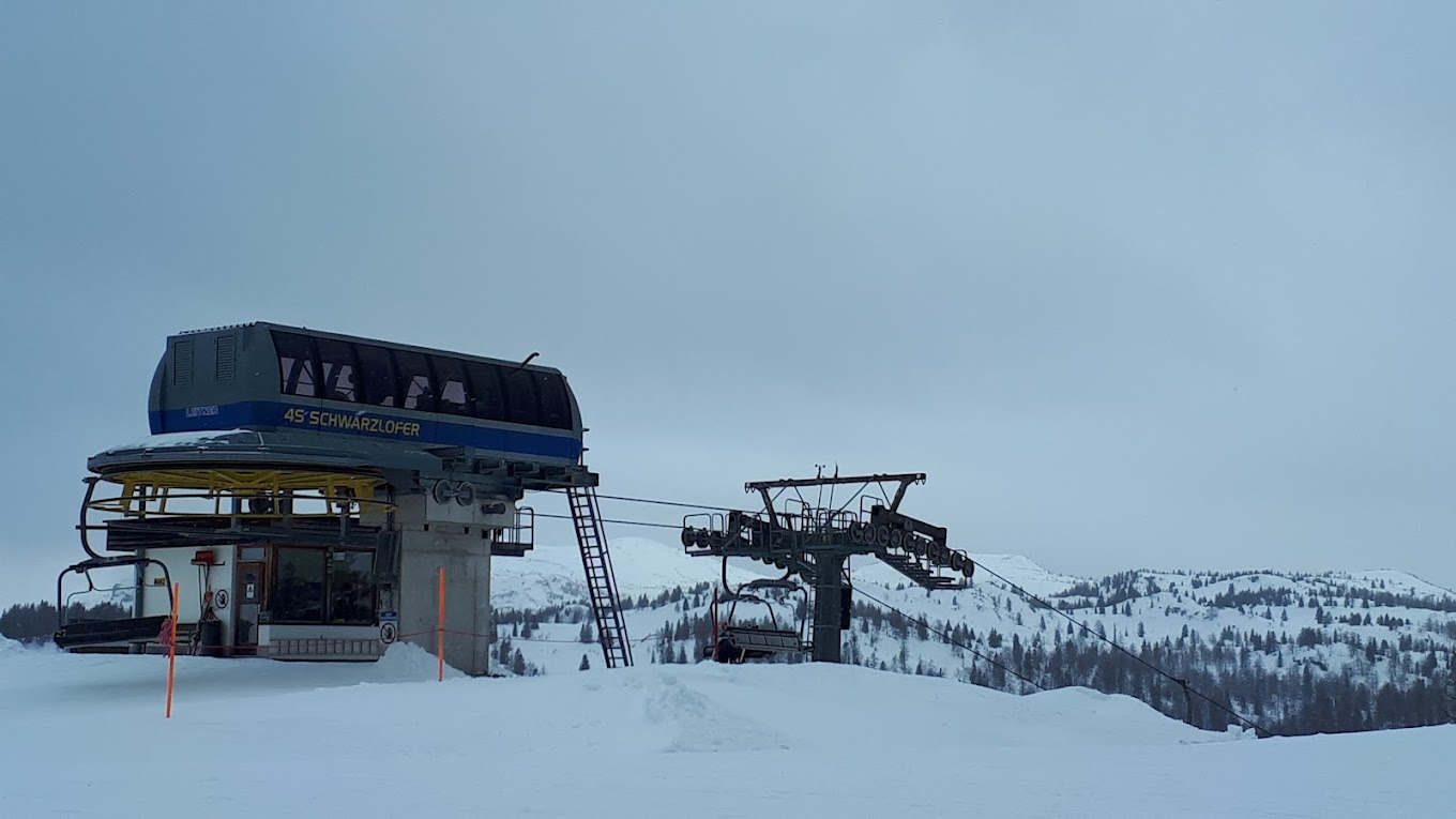 Winklmoos-Steinplatte in Austria - a ski lift going up a snowy hill.