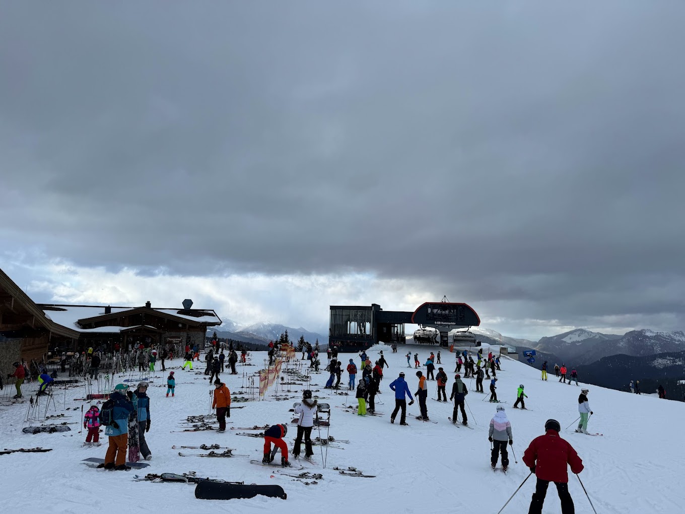 Winklmoos-Steinplatte in Austria - a group of people skiing down a snow covered slope.