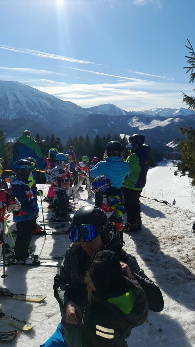 Hochbärneck – St Anton in Austria - a group of people sitting on top of a mountain.