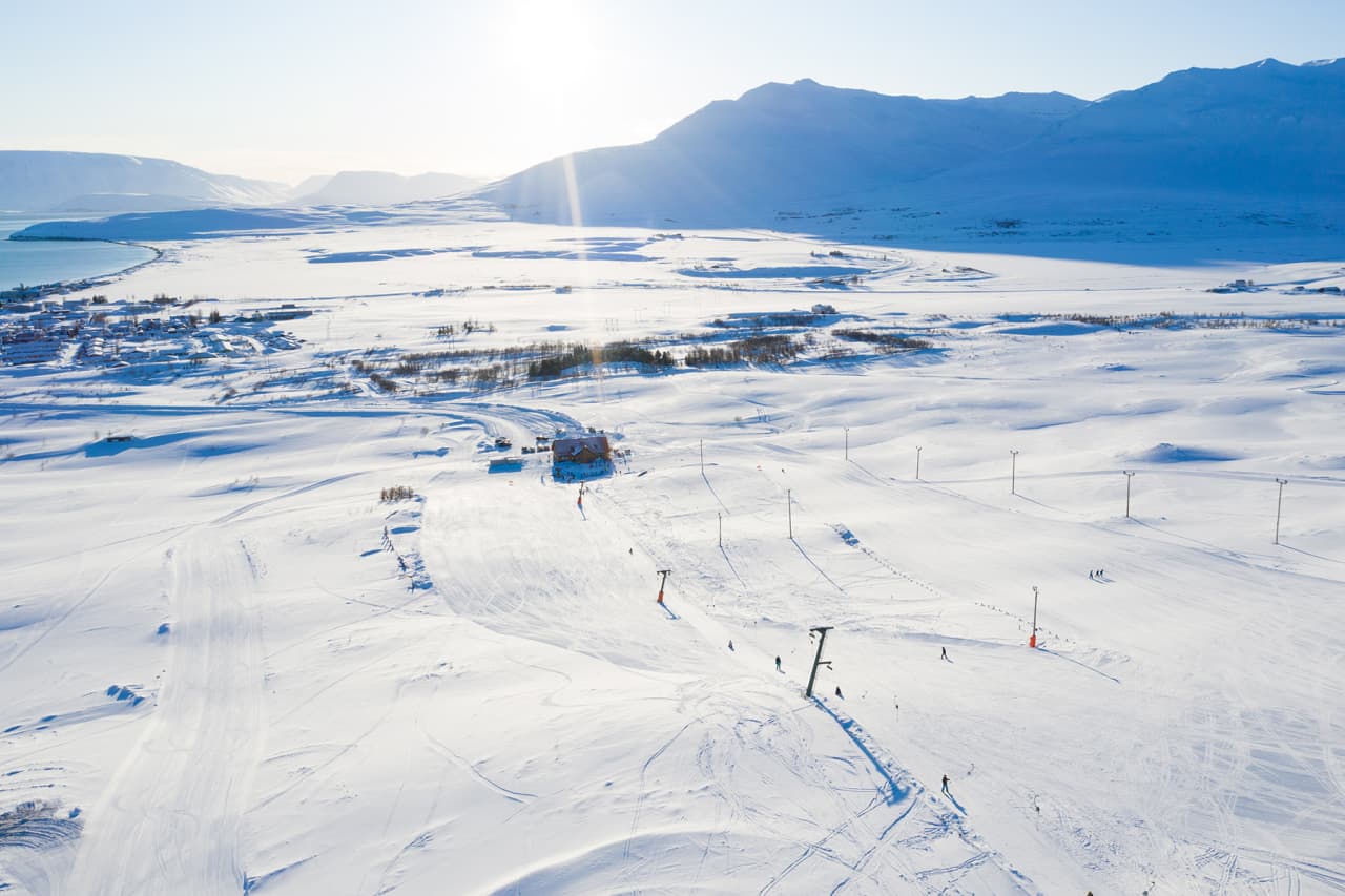 Dalvík in Iceland: an aerial view of a ski resort in the mountains.