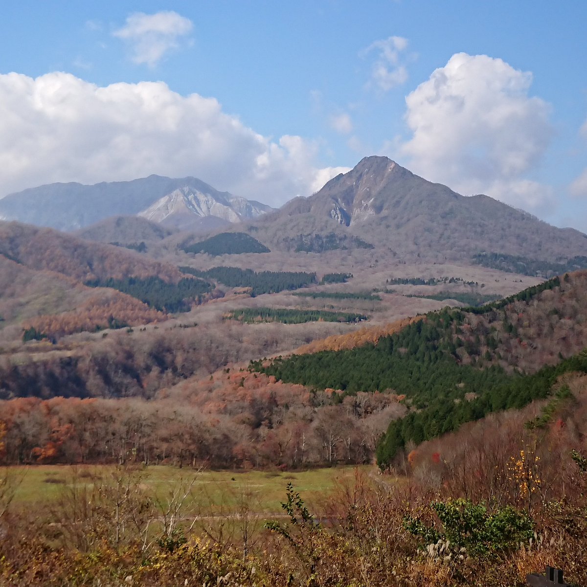 Kagamiganaru in Japan - a view of the mountains from the top of a hill.