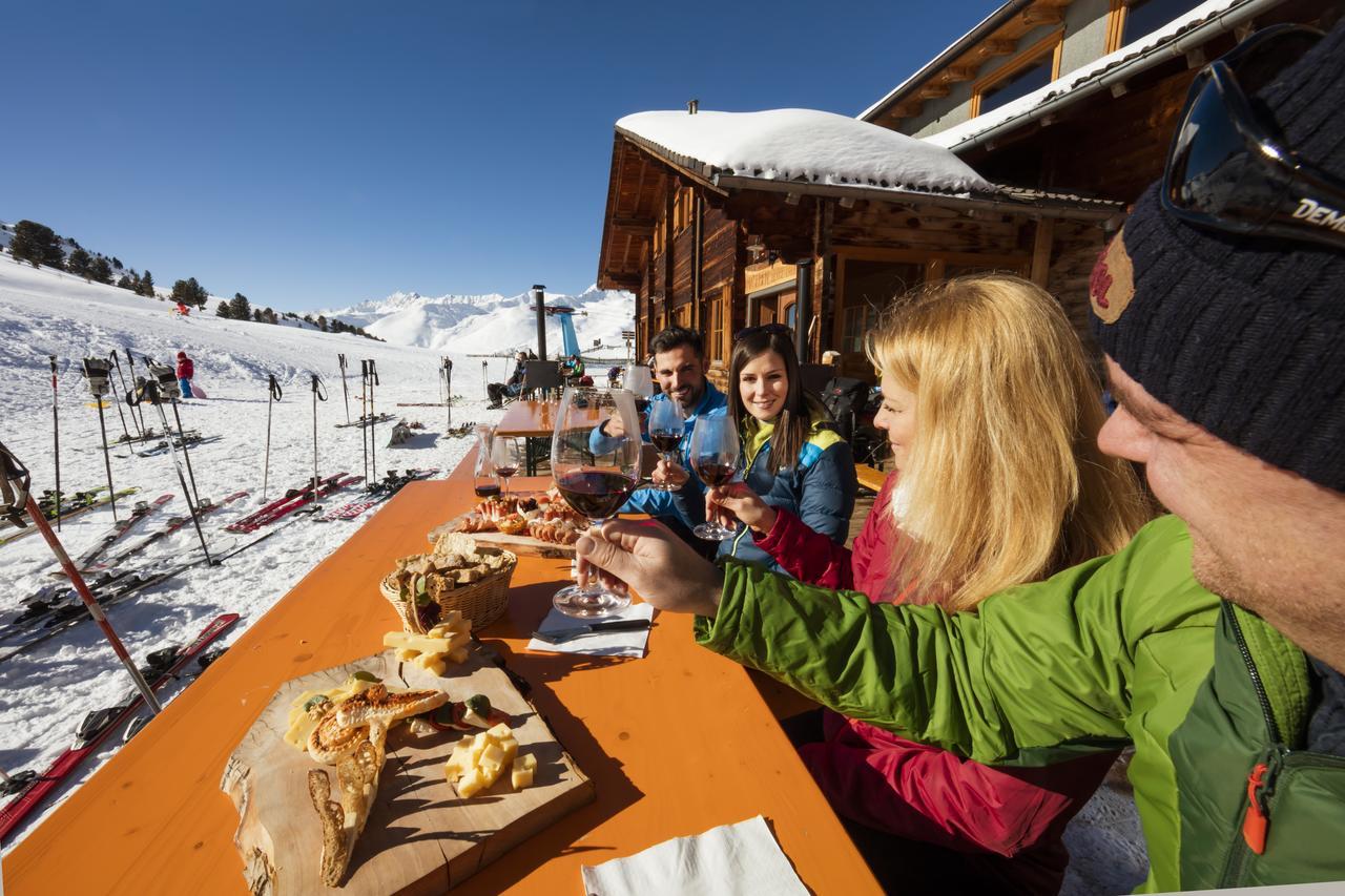 Maseben – Langtaufers in Italy - people sitting at a table in the snow.