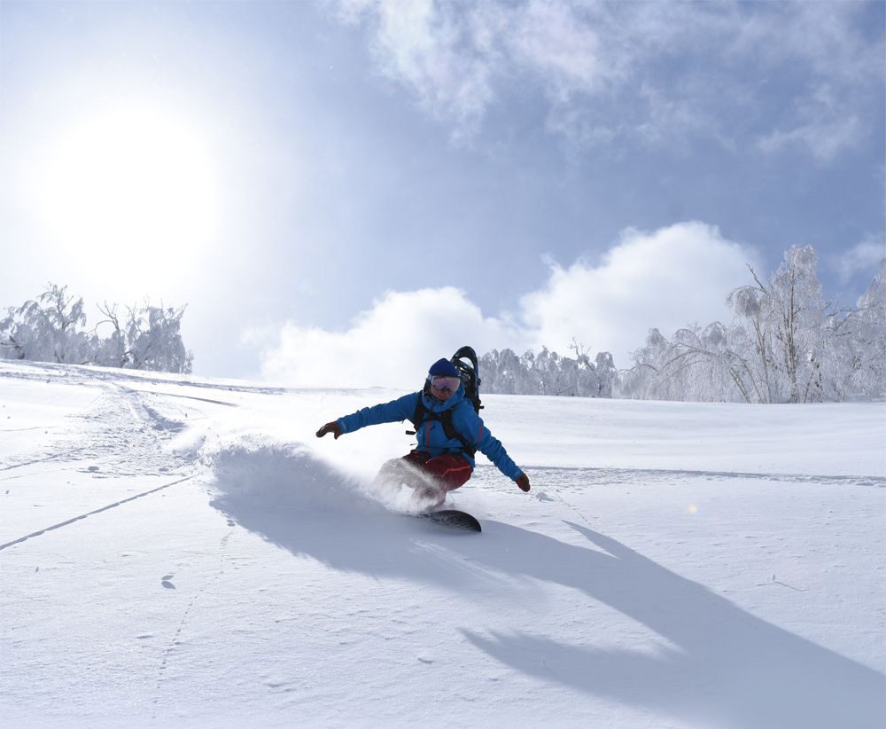 Sahoro in Japan - a person on a snowboard in the snow.