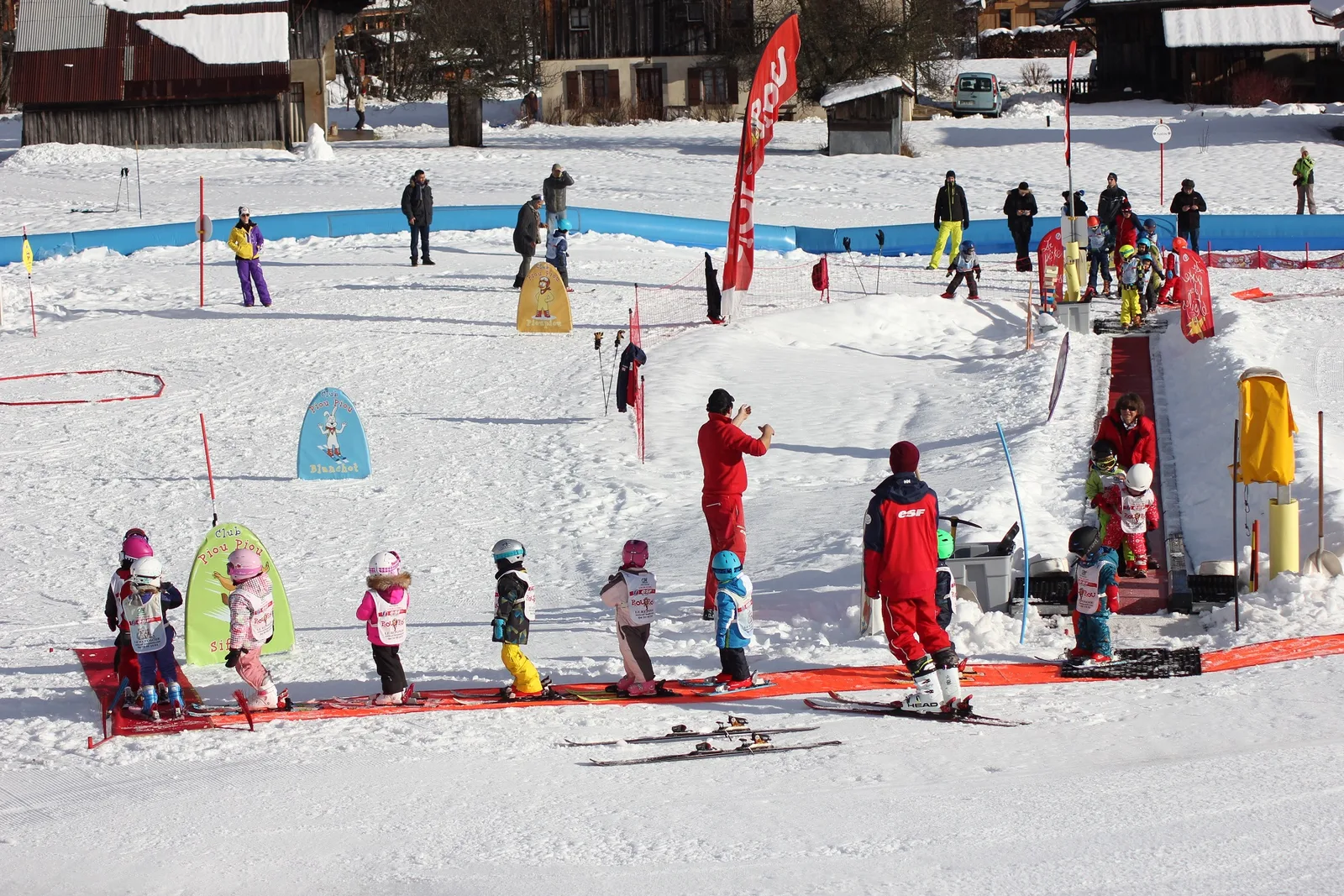 Le Reposoir – Village in France - a group of people that are standing in the snow.