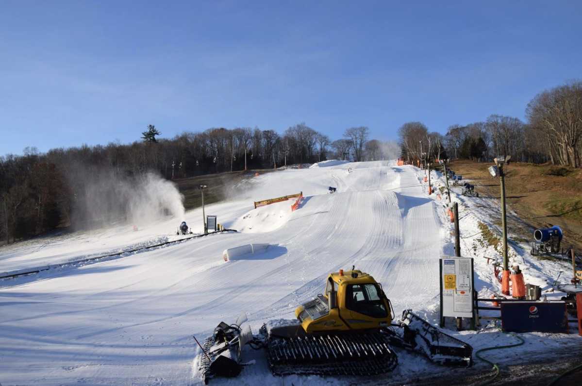 Woodbury in USA - a ski slope with a snow pling machine on it.