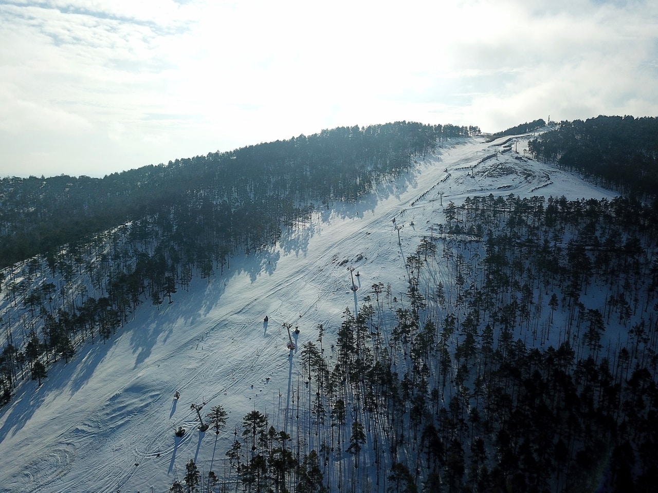 Crni Vrh in Serbia - a person skiing down a snowy mountain.