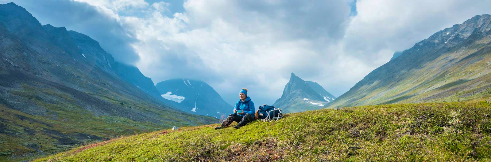 Gillersklack in Sweden - two people sitting on the side of a mountain.