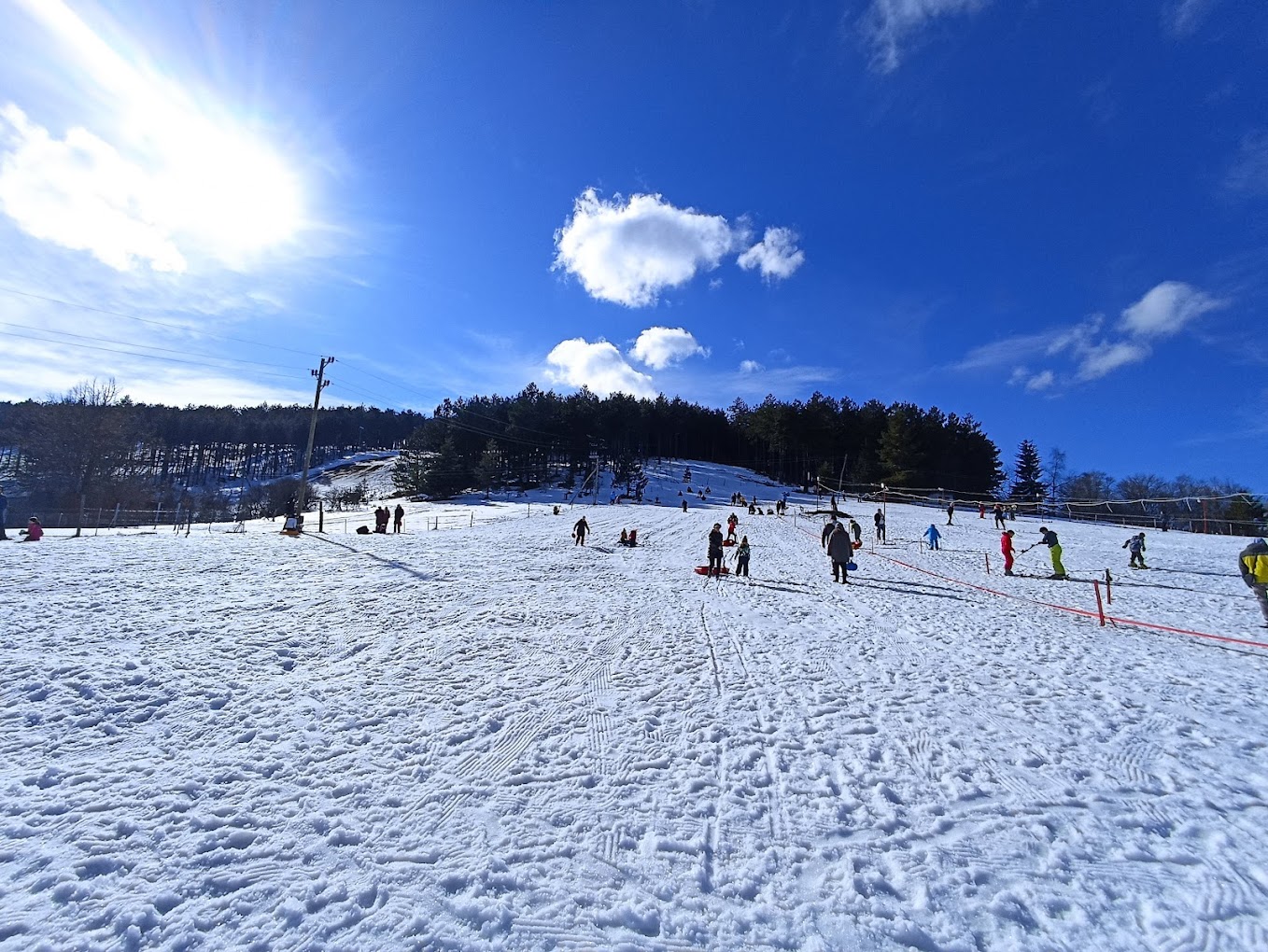 Sneško Goč in Serbia - a group of people skiing down a snow covered slope.