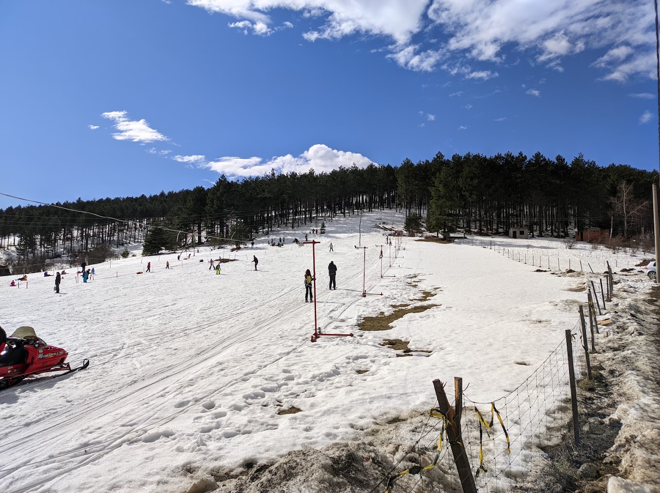 Sneško Goč in Serbia - a group of people skiing down a snowy slope.