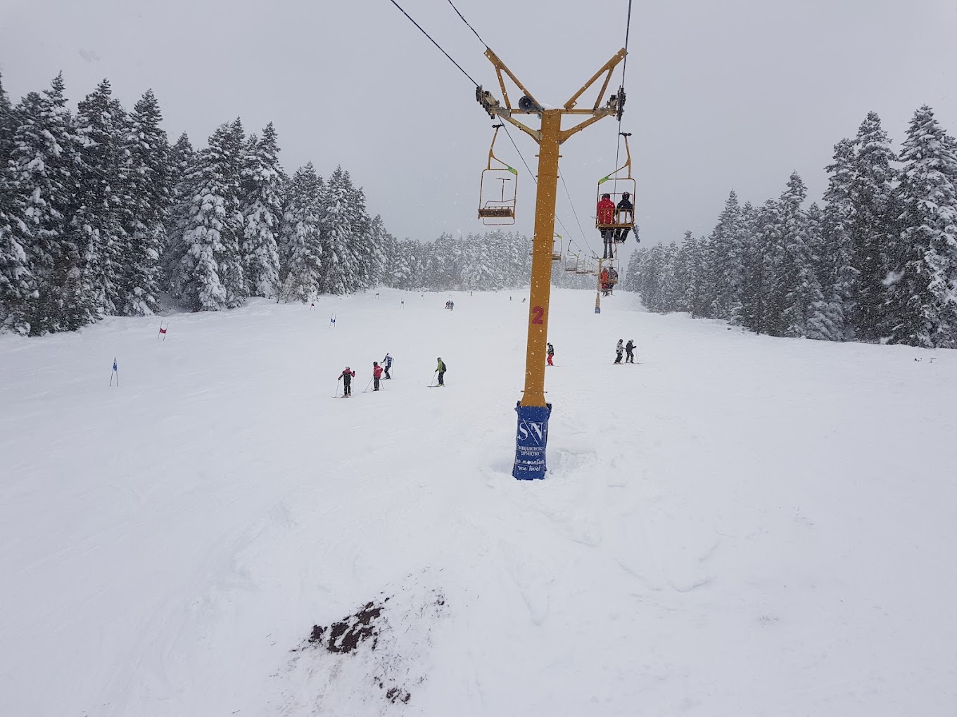 Kopanki in North Macedonia - a ski lift in the middle of a snowy forest.