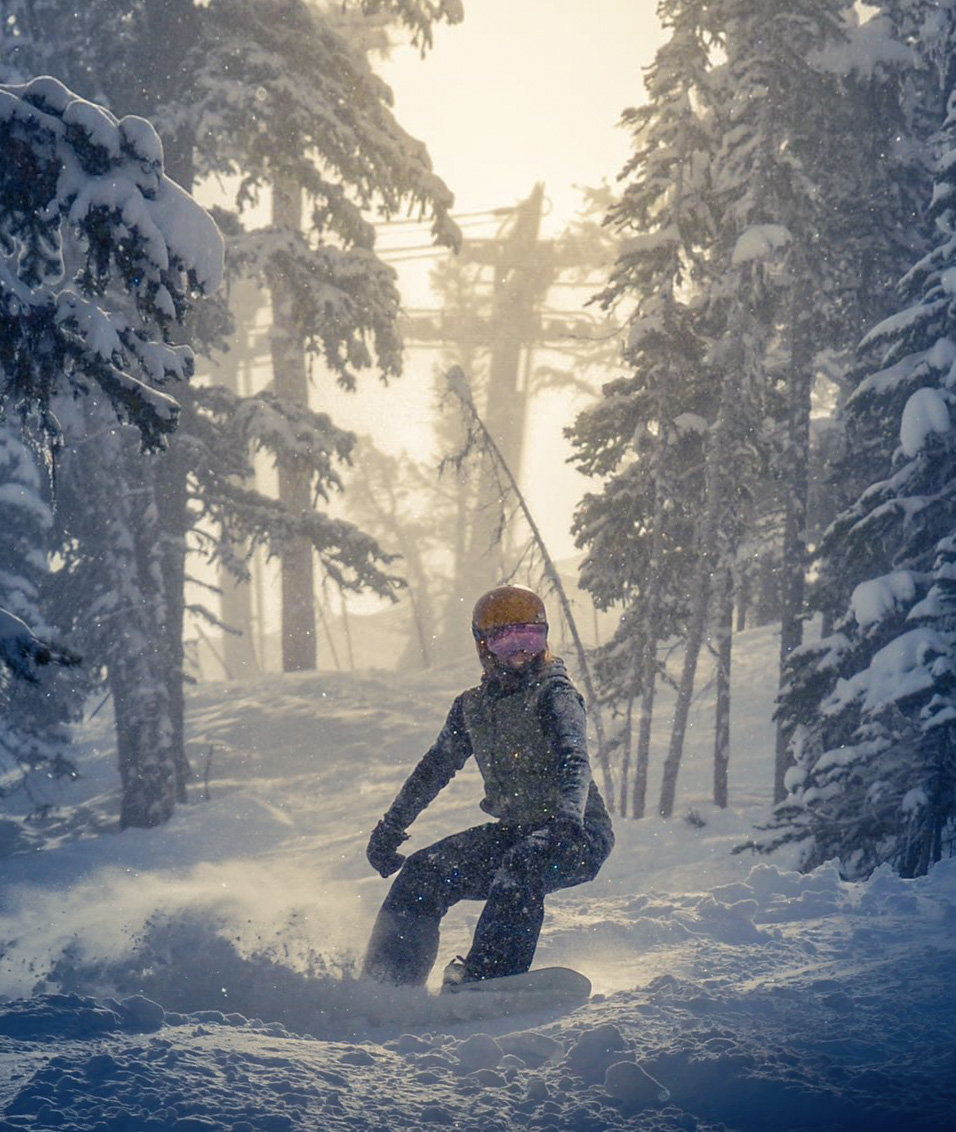 Nakiska in Canada - a person riding a snowboard in the snow.