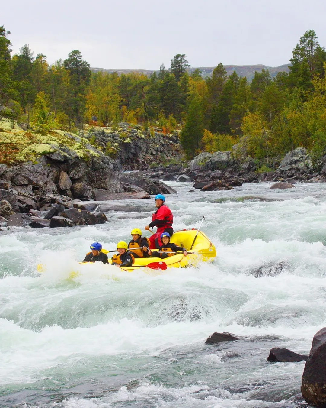 Dagali Fjellpark in Norway - a man in a yellow raft on a river.
