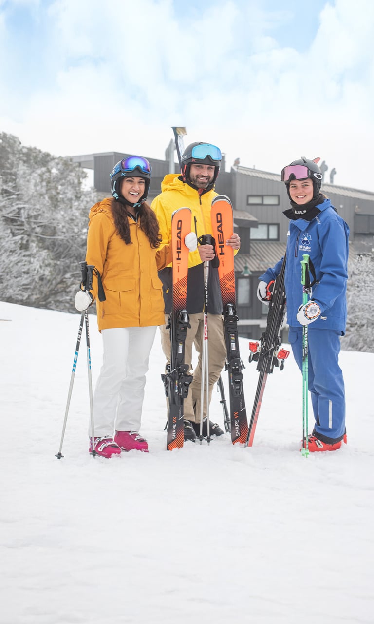 Mt Buller in Australia - a group of people standing on a snow covered slope.
