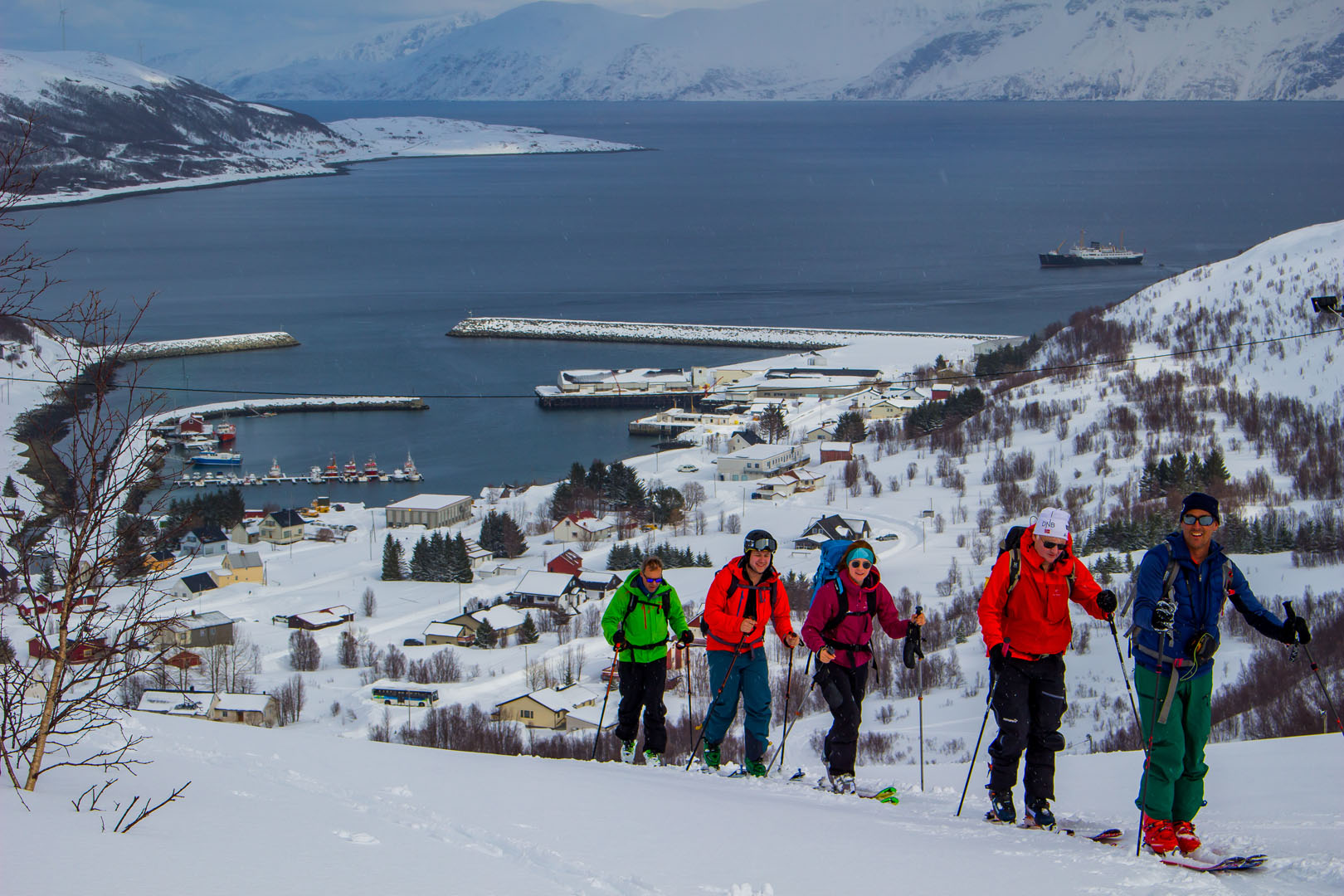 Tromsø in Norway - a group of people standing on top of a mountain.