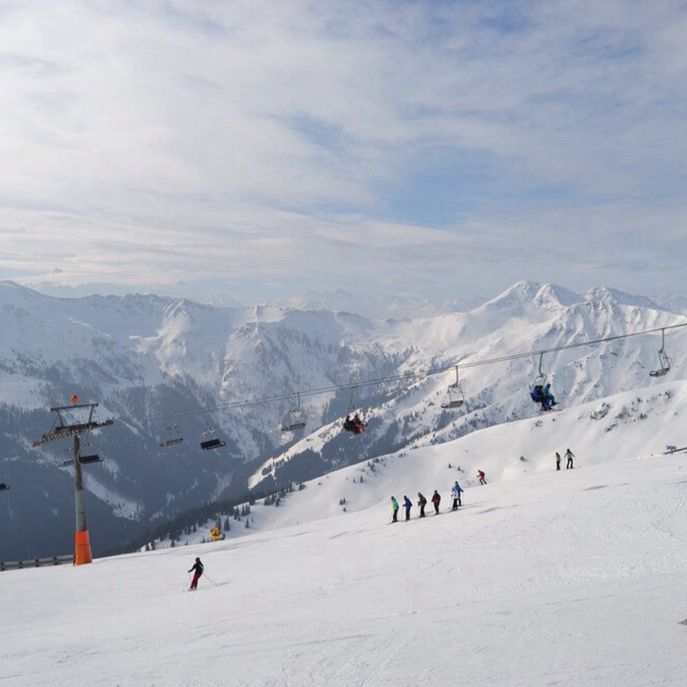 Hochlecken Skilifte in Austria - a group of people skiing down a snow covered mountain.
