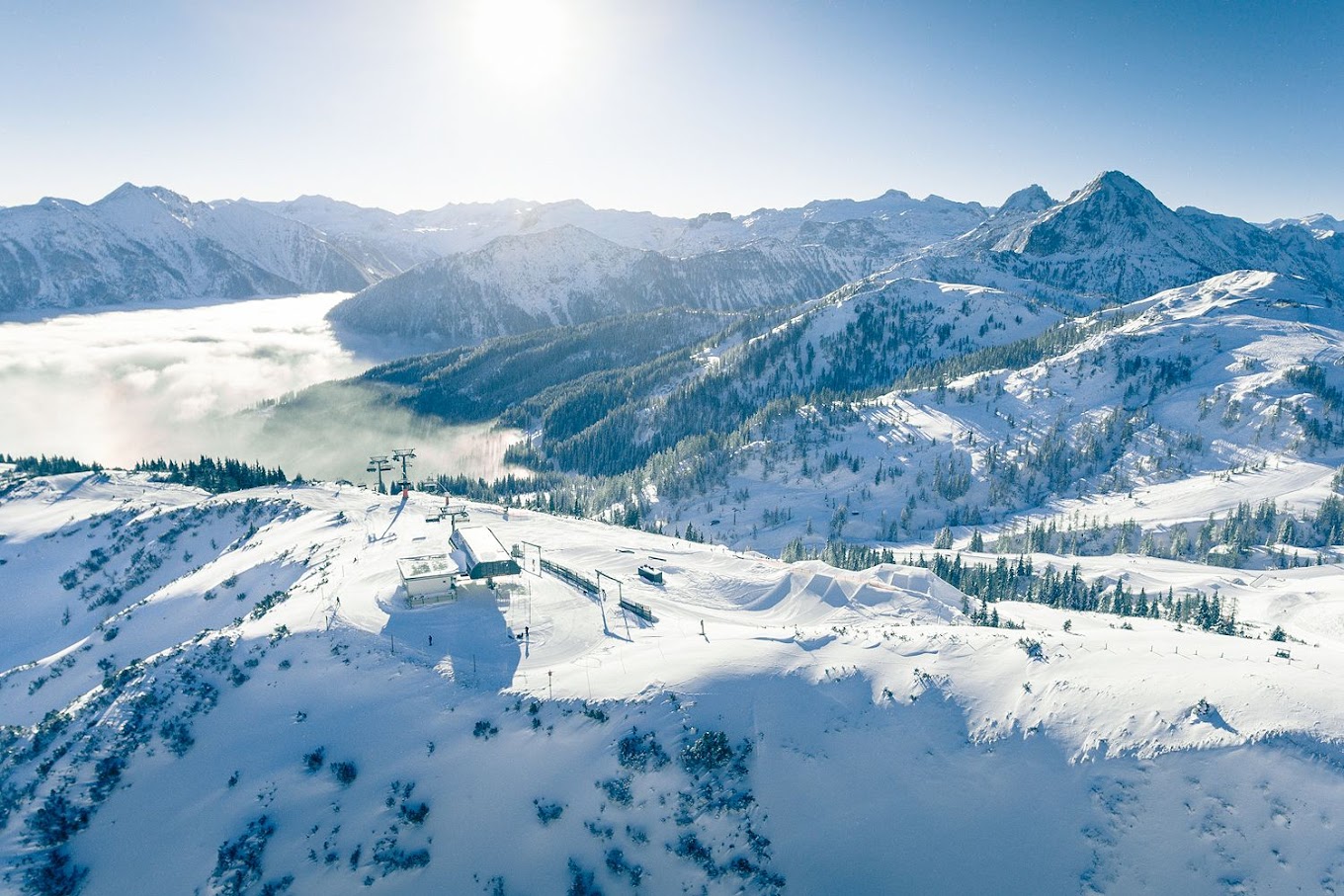 Salzbuger Sportwelt -Amade in Austria - a view from the top of a snowy mountain.