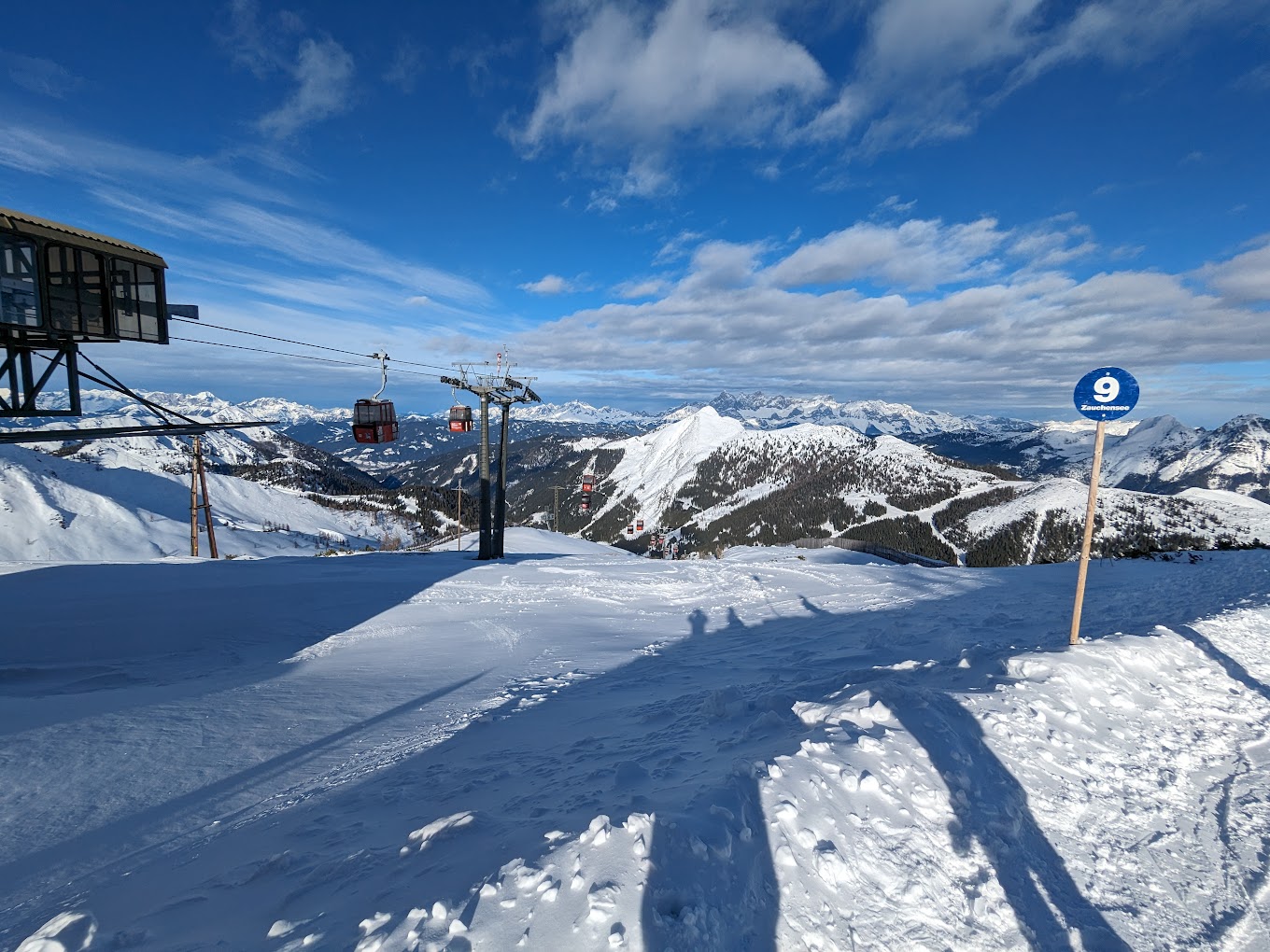 Salzbuger Sportwelt -Amade in Austria - a ski lift going up a snowy slope.