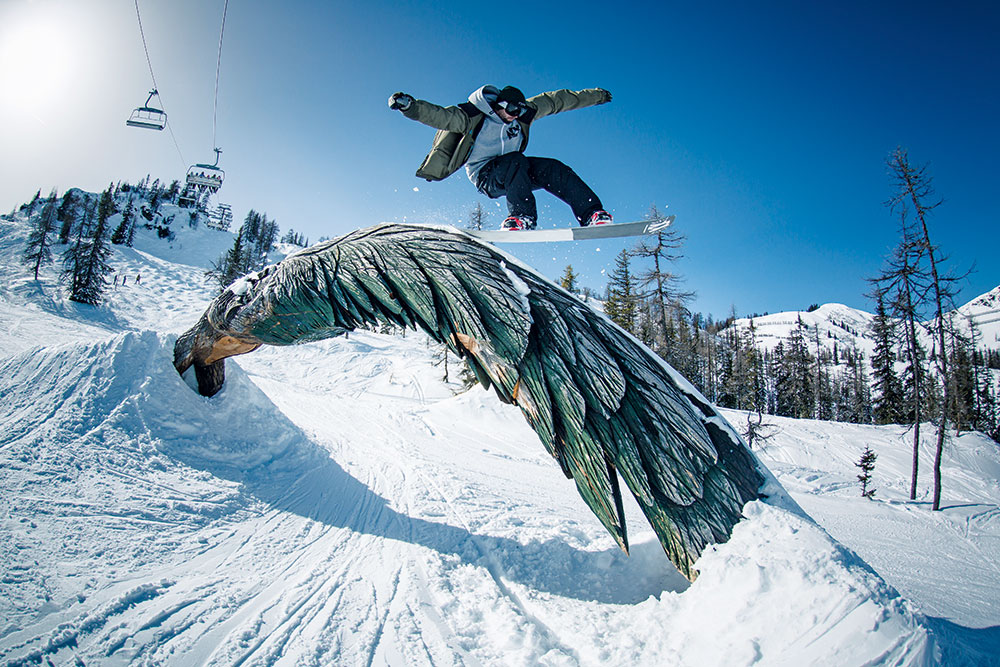 Salzbuger Sportwelt -Amade in Austria - a snowboarder doing a trick in the air.