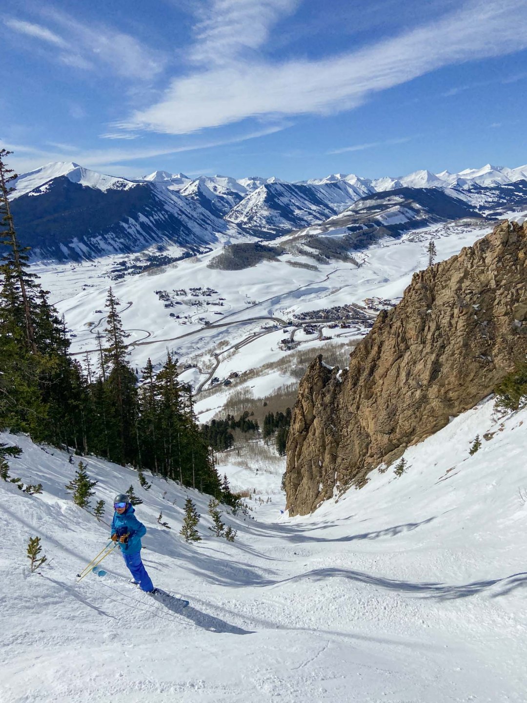 Crested Butte in USA - a person skiing down a snow covered mountain.
