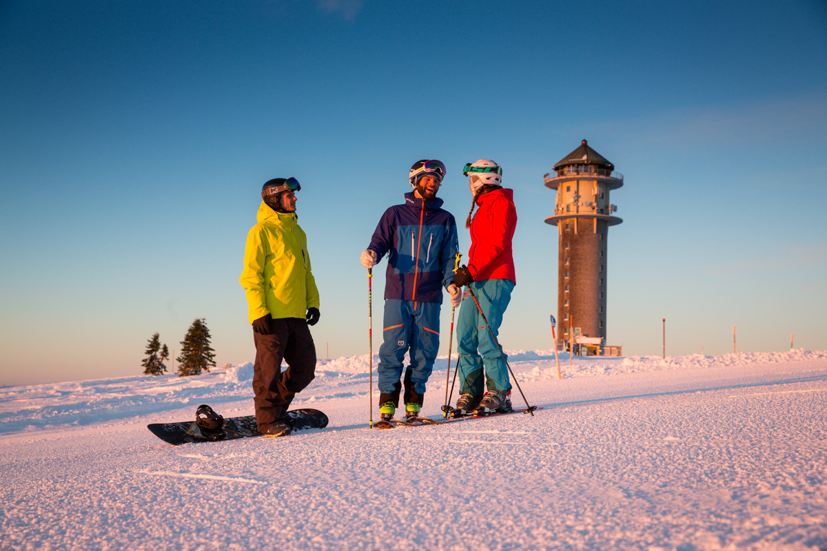 Schwarzenbachlift – Altglashütten in Germany - a group of people standing on a snow covered hill.